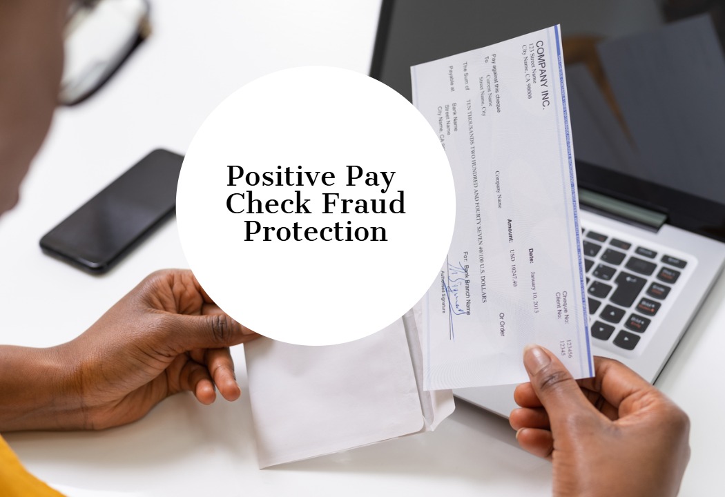 An advertisement about "Positive Pay check Fraud Protection" over a photo of a person about to insert a check into an envelope.