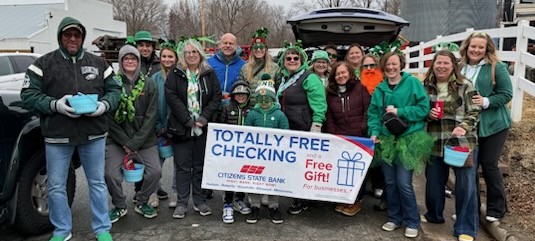A group of excited Citizens State Bank employees attending the annual St. Patrick's Day Parade in Roberts, WI.